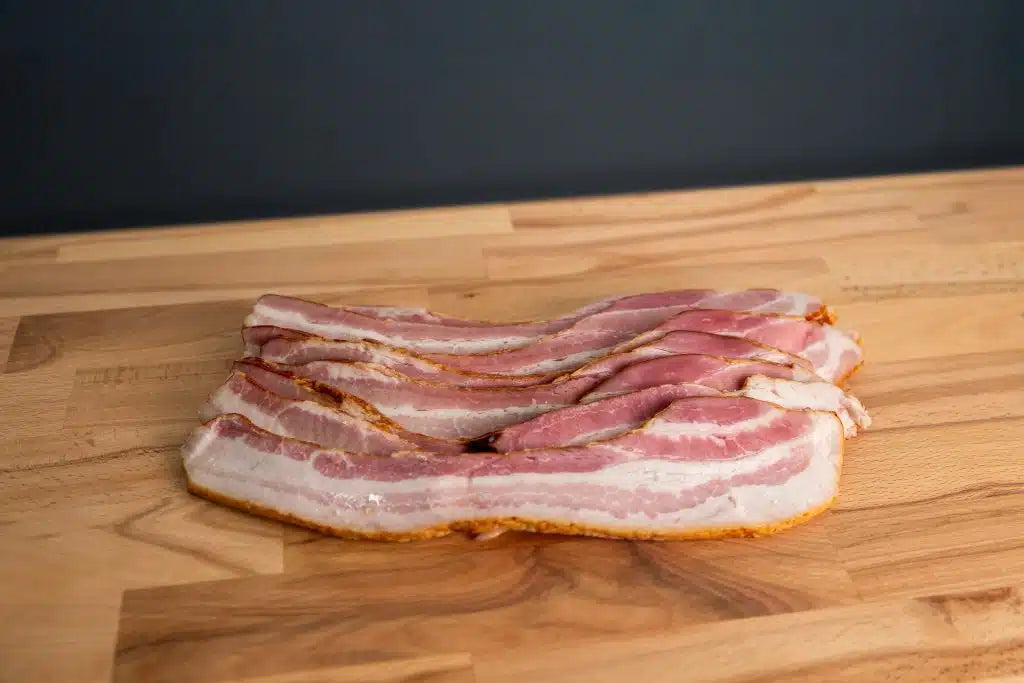 Gerookt ontbijtspek van De Herkomst, dik gesneden, 150 g