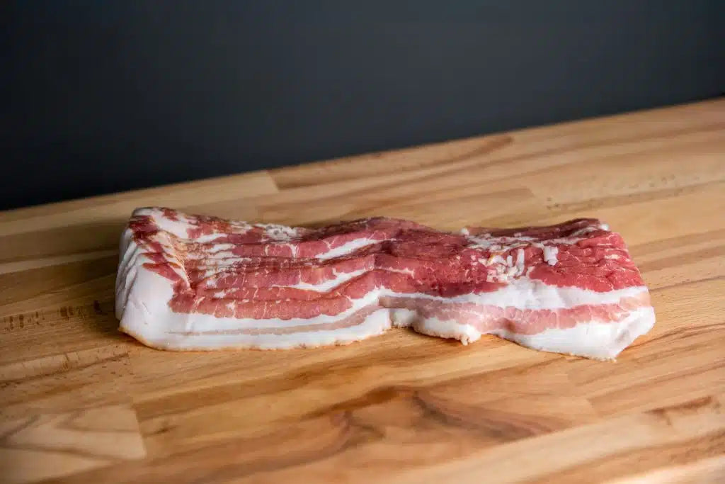 Gerookt ontbijtspek van De Herkomst, dun gesneden, 150 g